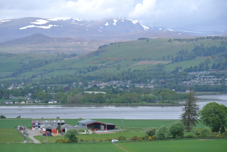 Dingwall, over the Cromarty Firth, from Ferintosh. Beyond the mountains lies the Strathcarron