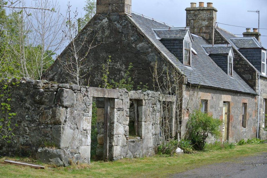 Ruins of the Gledfield blacksmith shop, and the Ross home beyond.